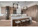 Modern kitchen with an expansive island and sleek cabinetry at 11380 E Sand Hills Rd, Scottsdale, AZ 85255