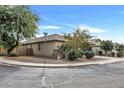 One-story home showcasing a side view with mature trees at 1263 E Palo Verde Dr, Casa Grande, AZ 85122