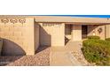 Front view of the house, showing the entrance and landscaping at 17633 N Lindner Dr, Glendale, AZ 85308