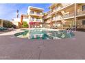 Community pool with lounge chairs and patio area at 3600 N 5Th Ave # 304, Phoenix, AZ 85013