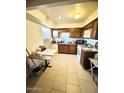 Well-equipped kitchen with wood cabinets and tile floor at 3840 N 43Rd Ave # 29, Phoenix, AZ 85031