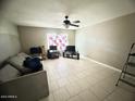 Spacious living room with tile floors and ceiling fan at 3840 N 43Rd Ave # 29, Phoenix, AZ 85031