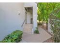 Condo building exterior showing walkway and landscaping at 7272 E Gainey Ranch Rd # 73, Scottsdale, AZ 85258