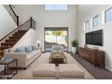 Spacious living area with high ceilings, sliding door to backyard, and hardwood floors at 10350 W Foothill Dr, Peoria, AZ 85383