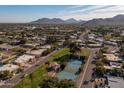 Community view with tennis courts, homes, and mountain backdrop at 10801 N 45Th St, Phoenix, AZ 85028