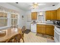 Eat-in kitchen with wood cabinets and modern appliances at 1140 E Vogel Ave, Phoenix, AZ 85020