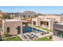 Modern home with a large pool and expansive backyard at 12659 E Shadow Ridge Dr, Scottsdale, AZ 85255