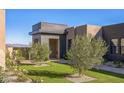 Private courtyard with drought-tolerant landscaping and artificial turf at 12659 E Shadow Ridge Dr, Scottsdale, AZ 85255
