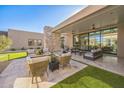 Relaxing patio with fire pit, comfortable seating and large sliding doors at 12659 E Shadow Ridge Dr, Scottsdale, AZ 85255
