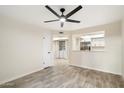 Bright living room with tile floors and ceiling fan at 1331 W Baseline Rd # 122, Mesa, AZ 85202