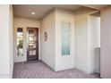 Front entry with tile flooring and a modern door at 13329 W Lone Tree Trl, Peoria, AZ 85383