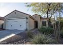 One-story home with desert landscaping and two-car garage at 26053 W Tonopah Dr, Buckeye, AZ 85396