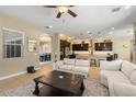 Open floorplan living room with adjacent kitchen at 4417 E John St, Gilbert, AZ 85295