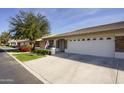 View of house exterior and neighborhood showing curb appeal at 11250 E Kilarea Ave # 252, Mesa, AZ 85209