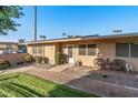 Tan single story home with lawn and walkway at 13427 N 111Th Ave, Sun City, AZ 85351