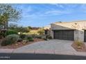 Contemporary home with paver driveway and desert landscaping at 16064 E Ridgestone Dr, Fountain Hills, AZ 85268