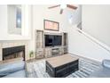 Living room with entertainment center and fireplace at 1718 S Longmore -- # 40, Mesa, AZ 85202