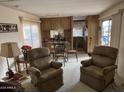 Spacious living room with comfortable seating and dining area at 4065 E University Dr # 140, Mesa, AZ 85205
