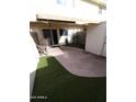 Private backyard with patio and artificial turf at 1217 E Fremont Dr, Tempe, AZ 85282