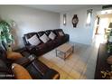 Living room with brown reclining sofa and coffee table at 1217 E Fremont Dr, Tempe, AZ 85282