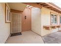 Front door entrance with security door and small planter at 13316 N 26Th Dr, Phoenix, AZ 85029