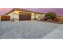 Home with a 2-car garage and a paved driveway, gated entry at 3538 E Hazeltine Way, Queen Creek, AZ 85142