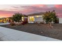 Modern home exterior with landscaping and a walkway at 3538 E Hazeltine Way, Queen Creek, AZ 85142