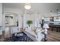 Open concept living room and kitchen with hardwood floors and modern decor at 4443 E Thorn Tree Dr, Cave Creek, AZ 85331