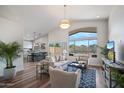 Bright living room with hardwood floors, modern furniture, and open floor plan at 4443 E Thorn Tree Dr, Cave Creek, AZ 85331