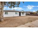 Newly renovated single story home with white brick exterior and modern landscaping at 1014 S Price Rd, Tempe, AZ 85281