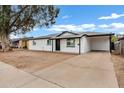 Newly renovated single story home with white brick exterior and modern landscaping at 1014 S Price Rd, Tempe, AZ 85281