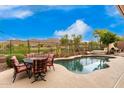 Inviting pool and spa with mountain views and outdoor seating at 2302 W Hazelhurst Dr, Anthem, AZ 85086