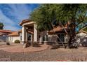 Charming one-story home with a well-maintained front yard and walkway at 2854 E Mallory St, Mesa, AZ 85213