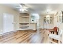 Bright living room with wood-look floors and built-in shelving at 17200 W Bell Rd # 1740, Surprise, AZ 85374