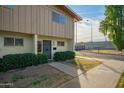 Townhome entrance with grey security door and shrubs at 2449 W Missouri Ave, Phoenix, AZ 85015
