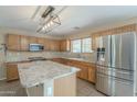 Spacious kitchen with granite countertops and stainless steel appliances at 2665 W Goldmine Mountain Dr, San Tan Valley, AZ 85144