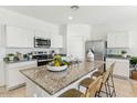 Modern kitchen with granite countertops and stainless steel appliances at 1562 E Mason Dr, Casa Grande, AZ 85122