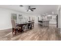 Spacious dining area with hardwood floors and large windows at 19641 E Emperor Blvd, Queen Creek, AZ 85142