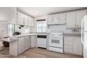 Efficient kitchen featuring white cabinetry and ample counter space at 205 S Higley Rd # 32, Mesa, AZ 85206