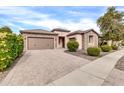 Single-story home with a large driveway and landscaping at 3016 E Maplewood St, Gilbert, AZ 85297