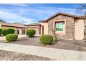 Single-story home with stone accents and landscaped front yard at 3016 E Maplewood St, Gilbert, AZ 85297