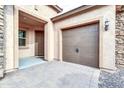 Two-car garage with paver driveway and walkway to front door at 3016 E Maplewood St, Gilbert, AZ 85297