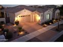 One-story home with a 2-car garage and a beautifully landscaped front yard at 4855 S Astral Hts, Mesa, AZ 85212