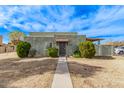 Cute stucco home with a walkway leading to the entrance at 5301 W Hearn Rd, Glendale, AZ 85306