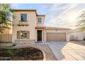 Beautiful two-story home with a two-car garage and front landscaping at 5413 W Beautiful Ln, Laveen, AZ 85339