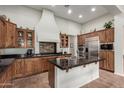 Spacious kitchen featuring granite countertops and wood cabinets at 12448 W Rosewood Ln, Peoria, AZ 85383