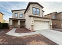 Two-story house with attached garage and landscaping at 13779 W Mauna Loa Ln, Surprise, AZ 85379