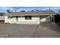 Ranch style home with carport and gravel yard at 2127 E Bayberry Ave, Mesa, AZ 85204