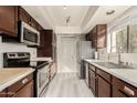 Modern kitchen with stainless steel appliances and wood cabinets at 3031 N Civic Center Plz # 224, Scottsdale, AZ 85251