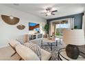 Living room with a view of the backyard and comfortable seating at 40030 W Venture Rd, Maricopa, AZ 85138
